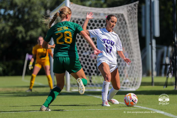 Gracie Brian (17) chases down the ball to keep it in play for TCU.